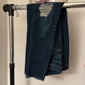 Kensie skinny jeans with raw hem and rip in knee